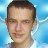 A selfie of my face in front of a light blue and white AiChaos logo.